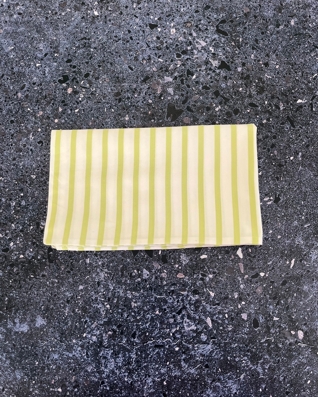 Green and white striped pillow case