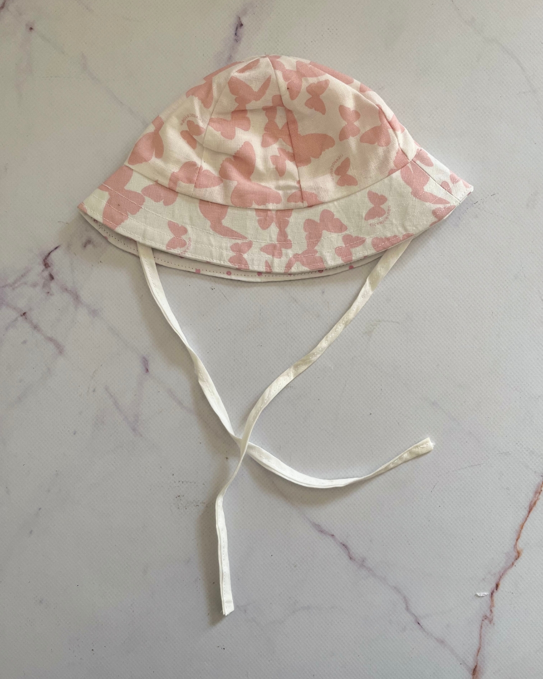 White and peach butterfly hat with string Small