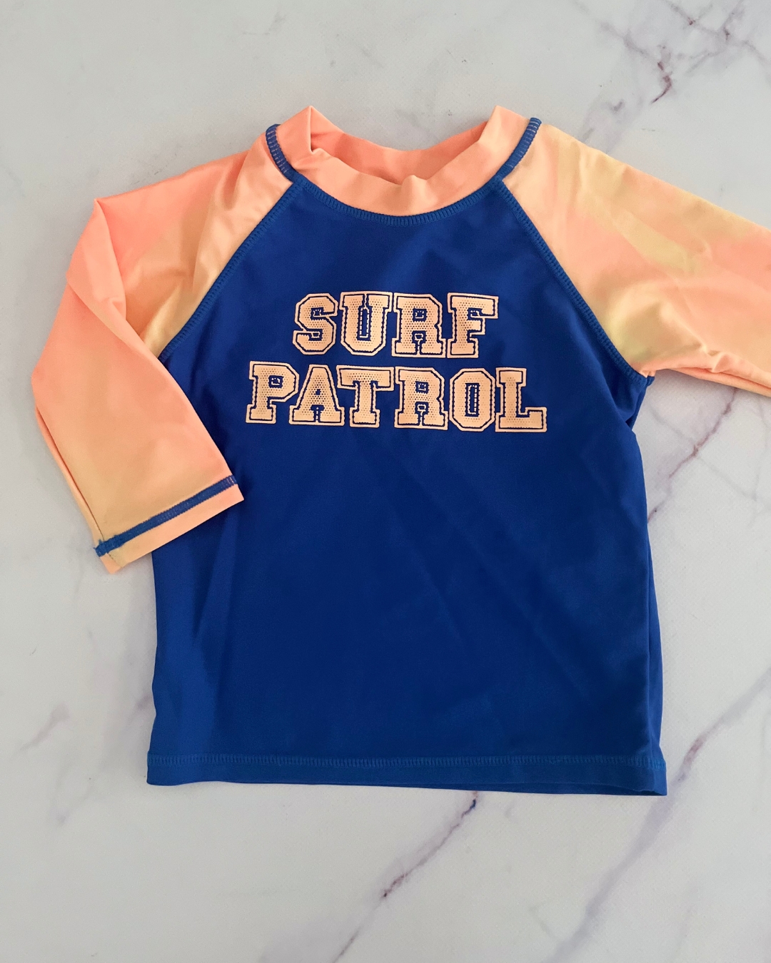 Blue and orange Surf patrol rash vest 4Y