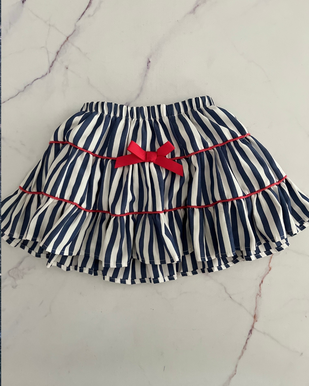 Flap Doodle blue, white and red bow skirt 2Y