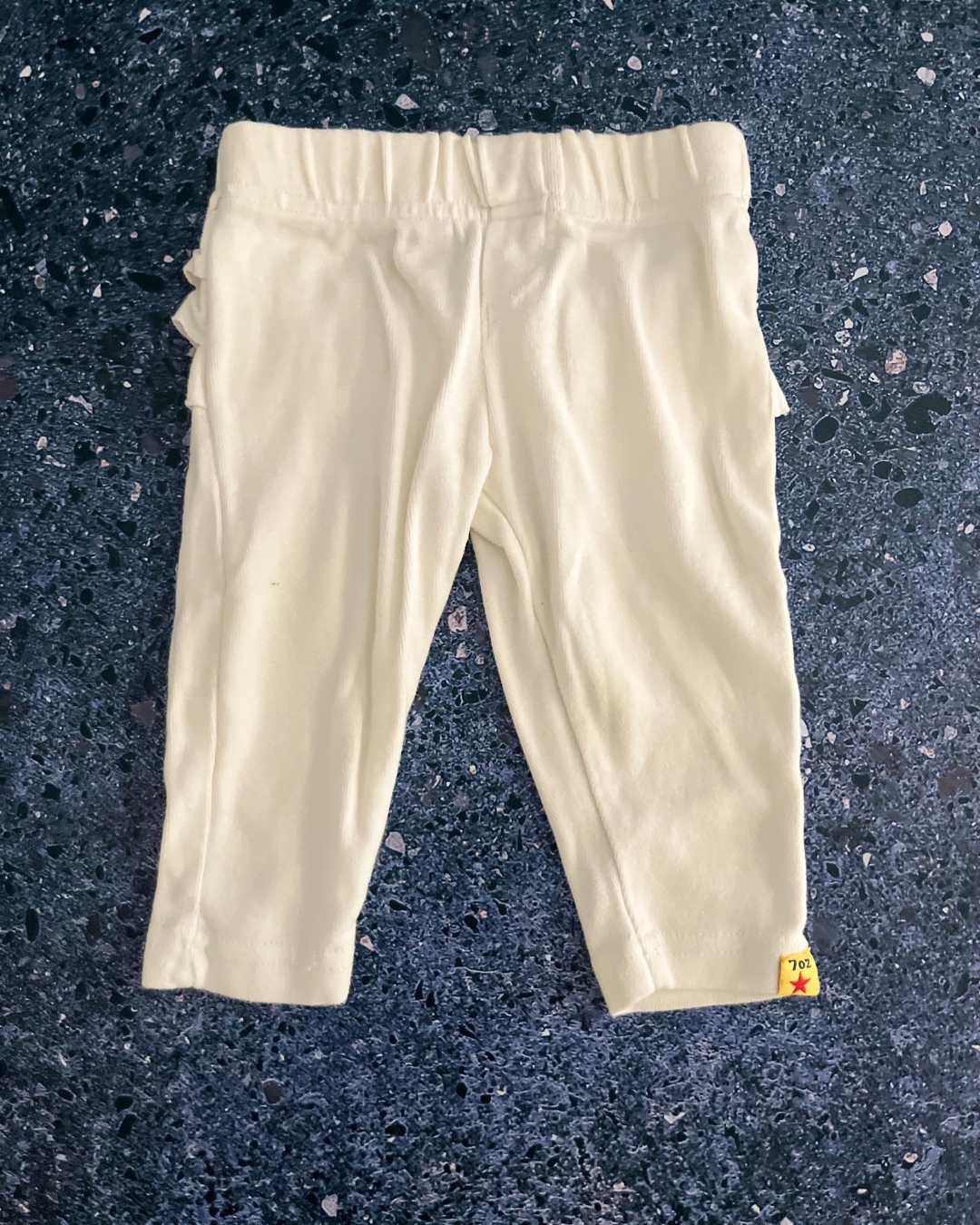 7 Ounce white pants with frilly bottom 0/3M