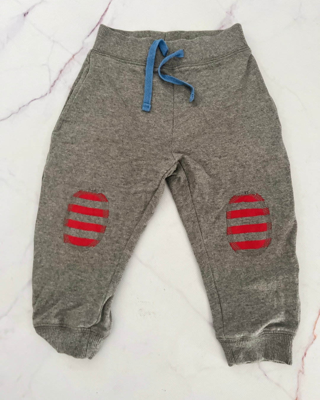Mothercare grey pants with red knee patches 12/18M