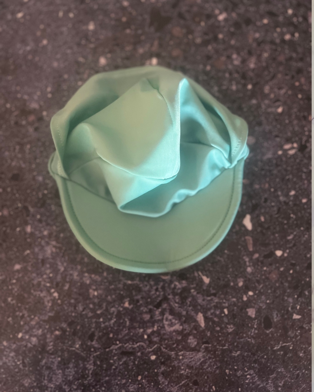 Woolworths green swimming hat 12/18M
