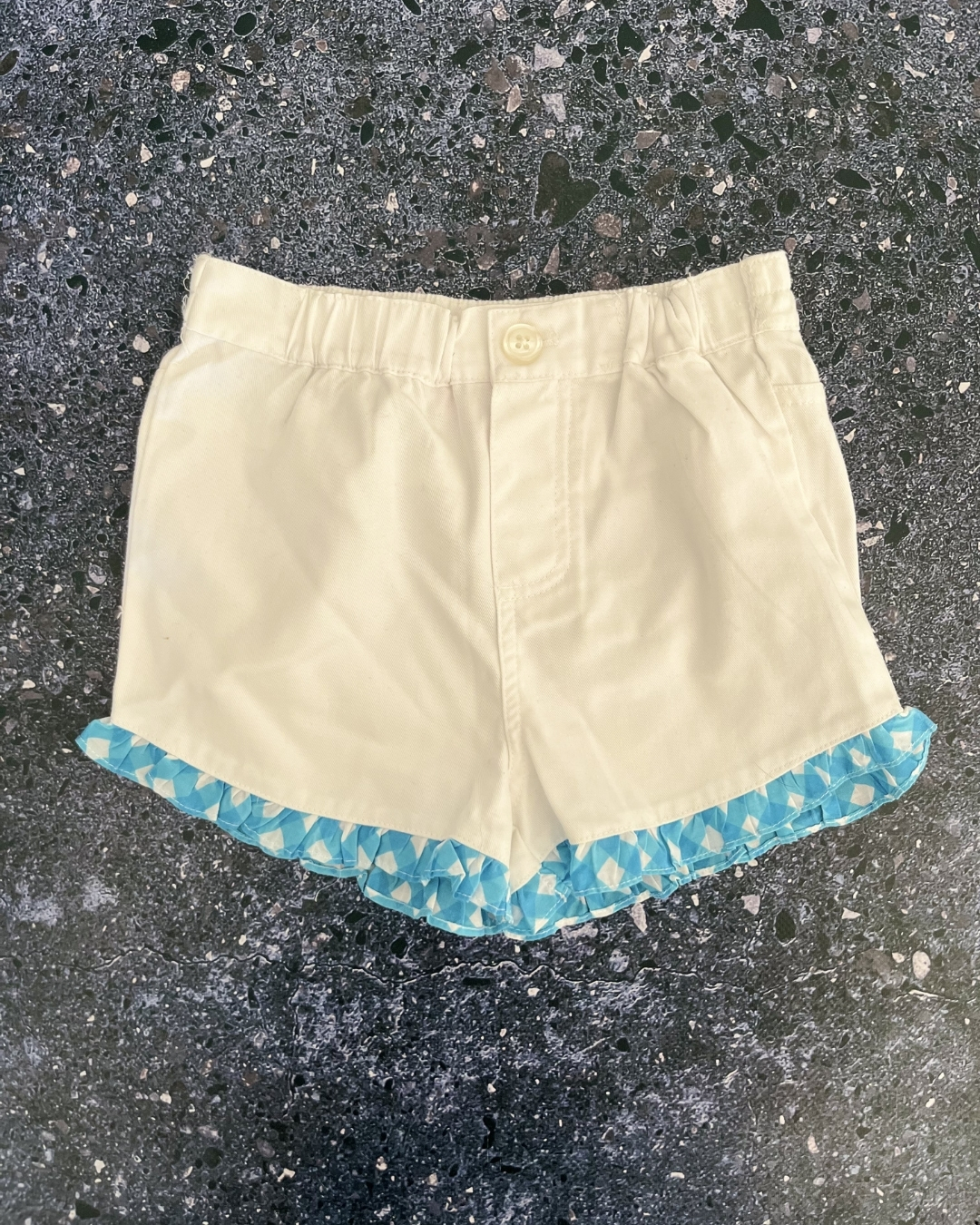White shorts with blue trim 4Y
