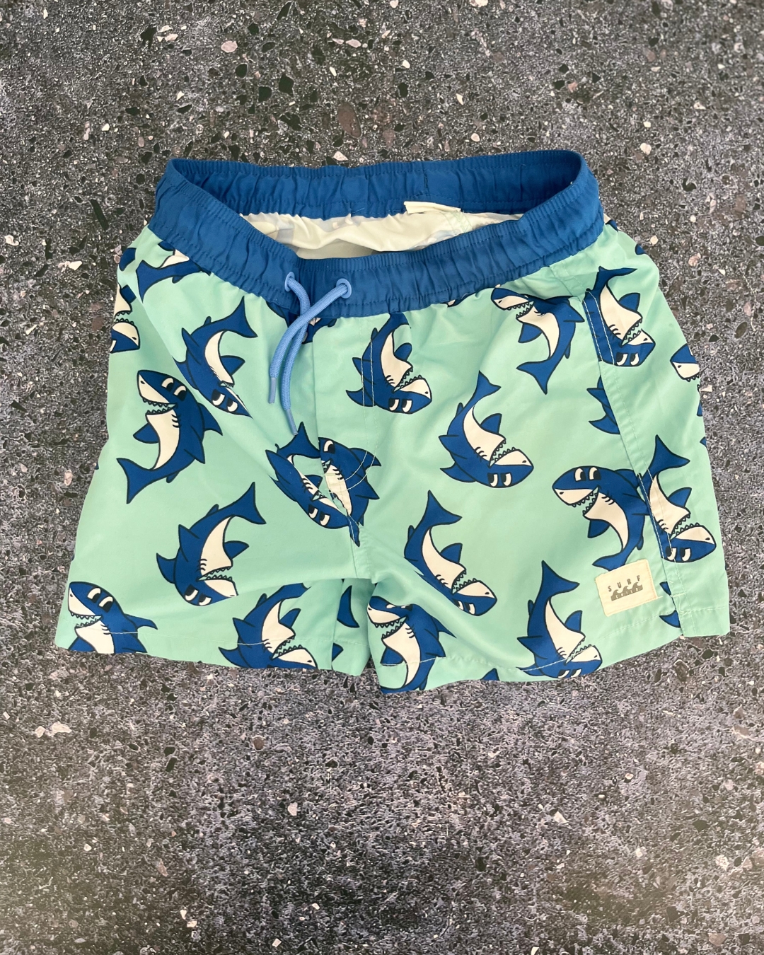 Cotton On blue sharks board shorts 7Y